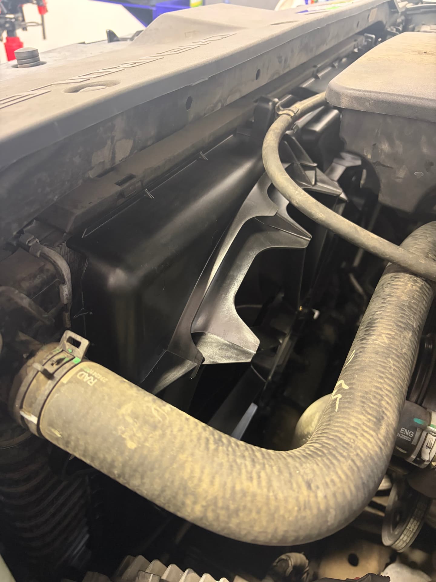 New radiator cooling fan installed behind the radiator of a Chevrolet Suburban at Johnny's Auto Repair near Spring Valley Lake in Victorville CA