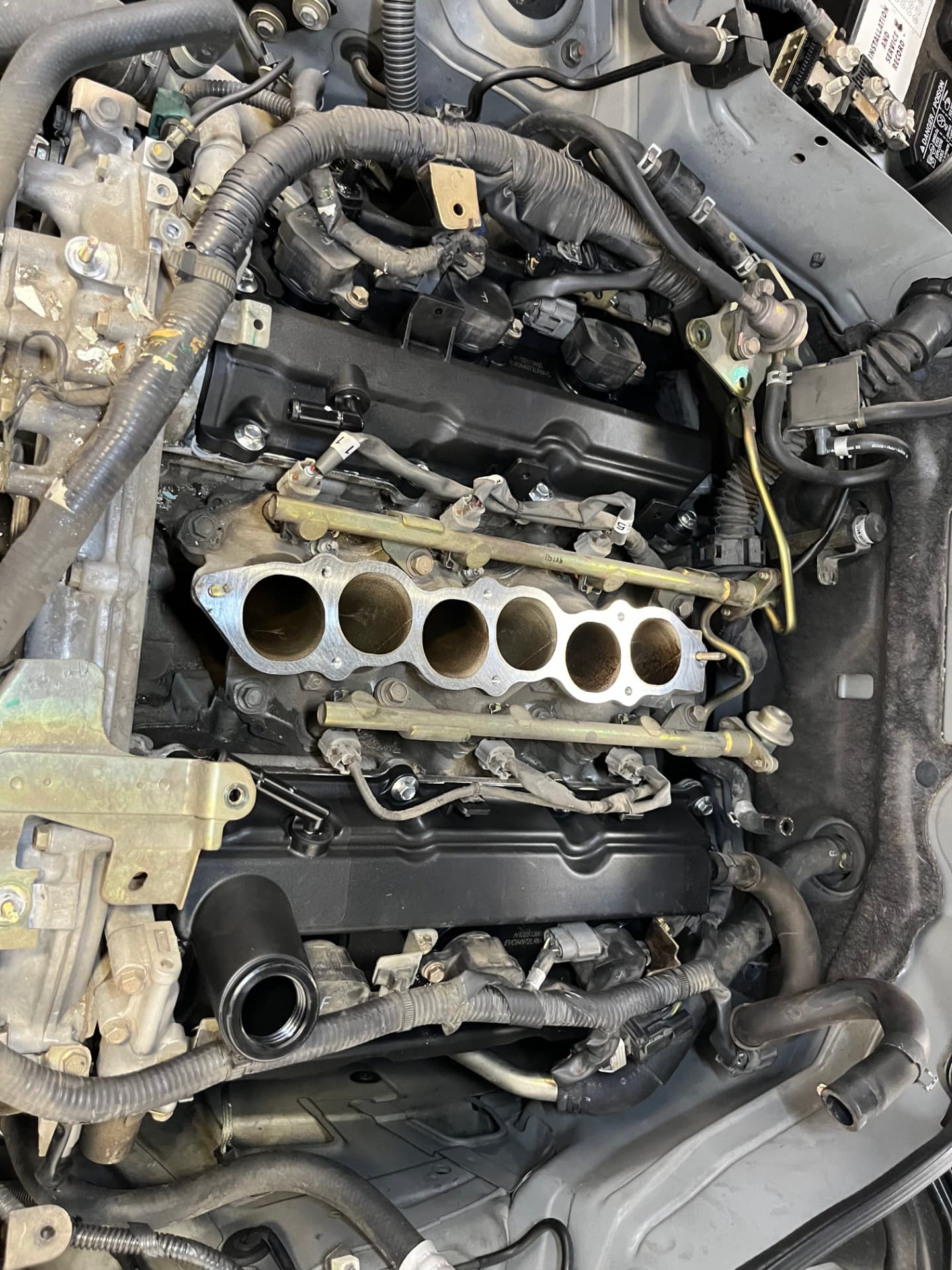 Exposed intake ports during an intake manifold repair at Johnny's Auto Repair near Spring Valley Lake in Victorville CA