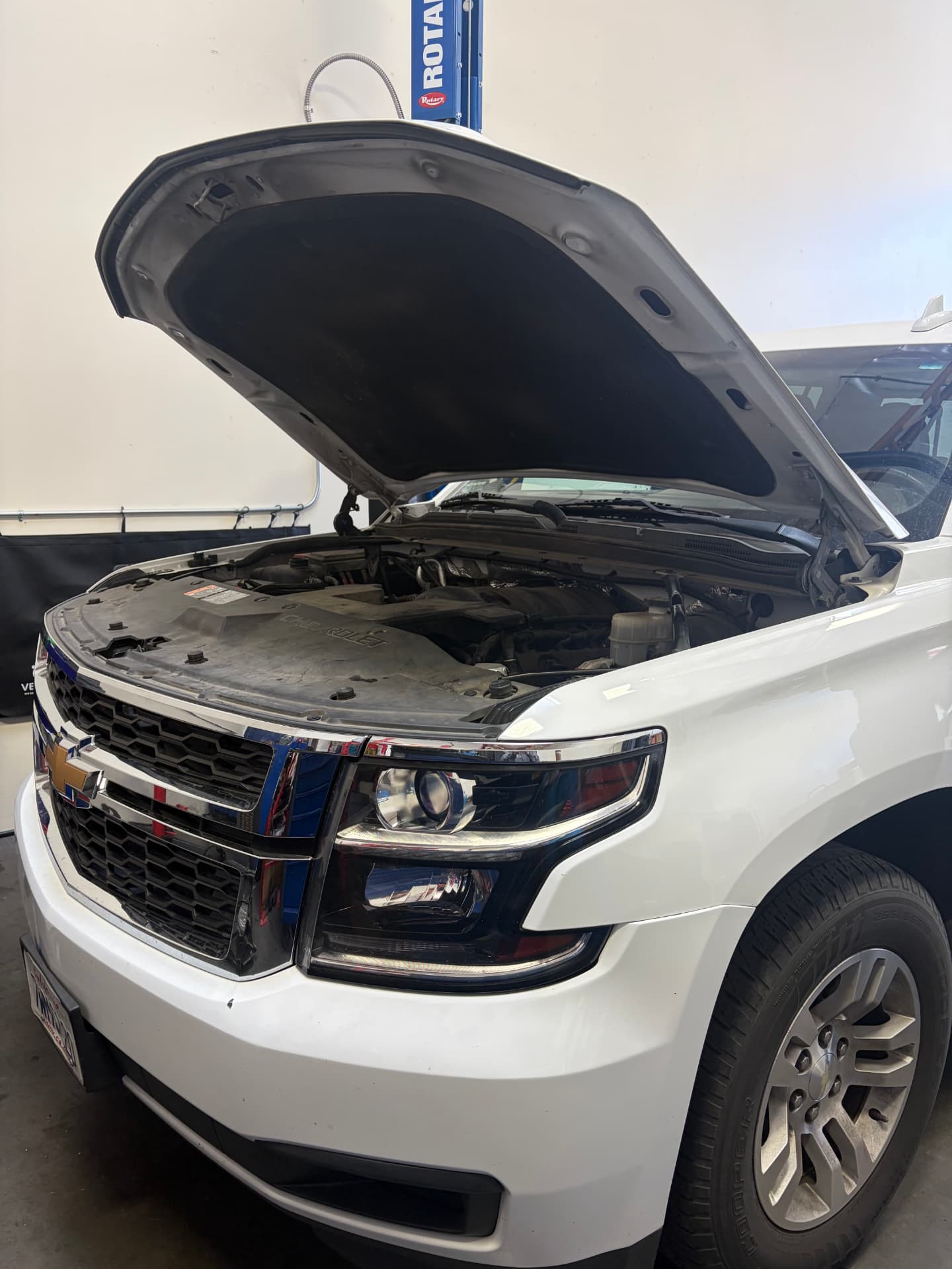 2017 Chevrolet Suburban in the service bay for cooling system repair at Johnny's Auto Repair near Spring Valley Lake in Victorville CA