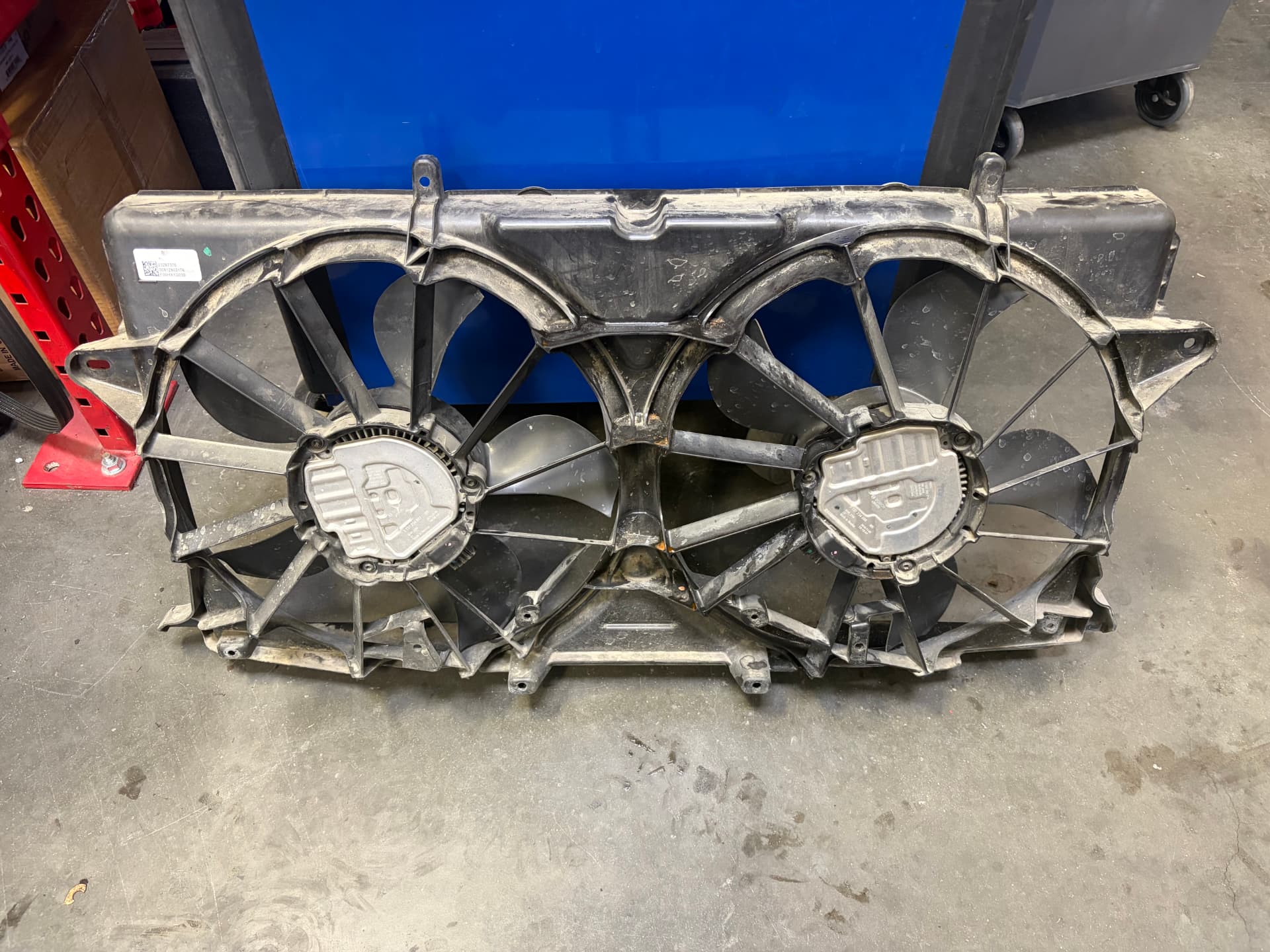 Removed radiator cooling fan assembly from a 2017 Chevrolet Suburban at Johnny's Auto Repair near Spring Valley Lake in Victorville CA