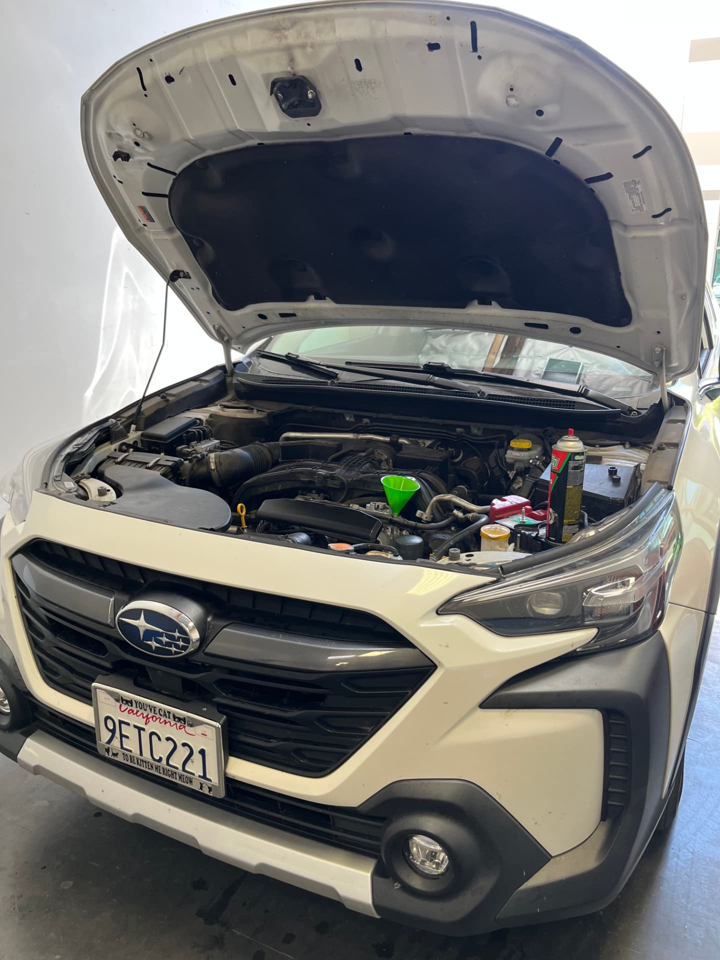 Subaru Outback receiving air conditioning compressor repair at Johnny's Auto Repair near Spring Valley Lake in Victorville CA